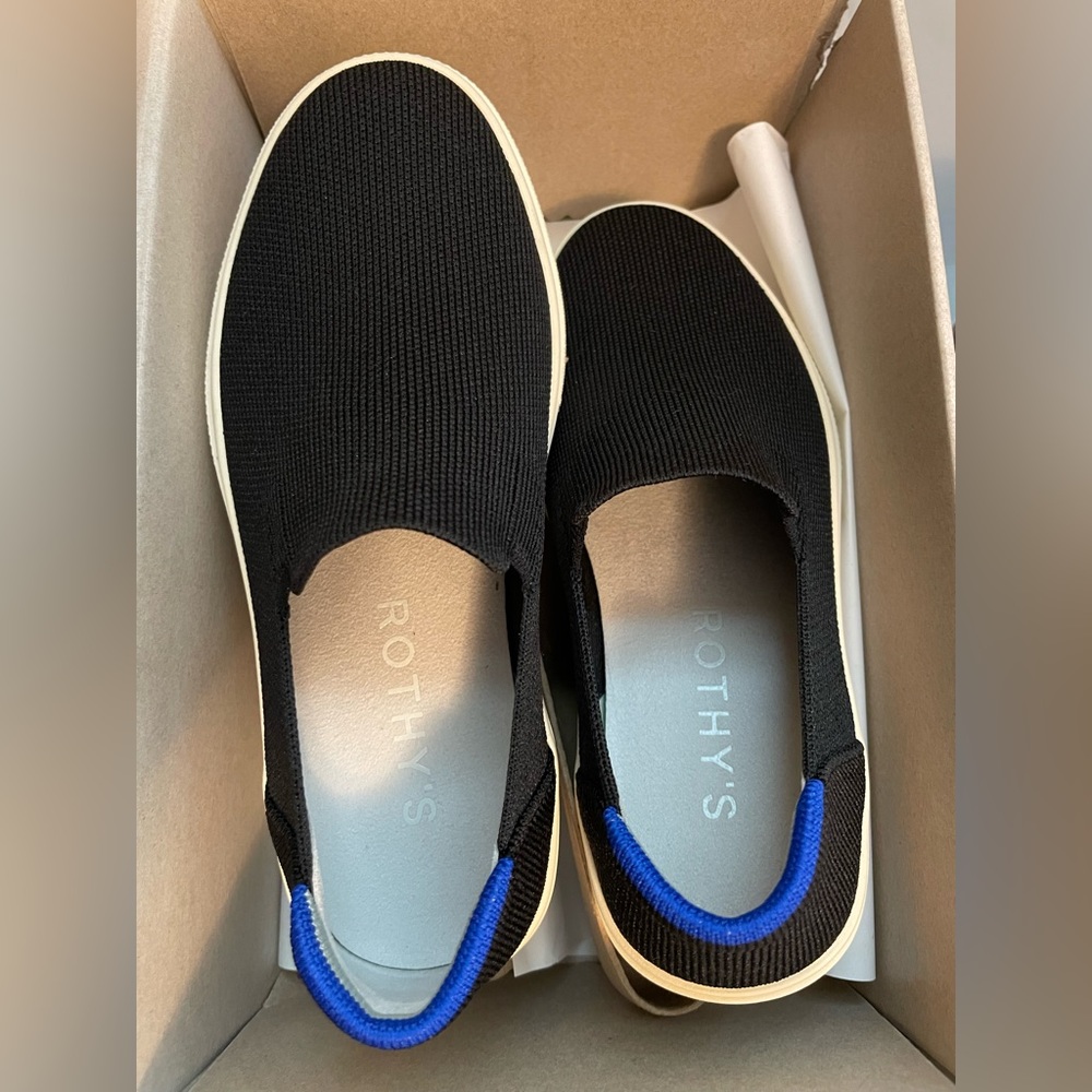 Rothy’s size 5.5W brand new slides. Black fabric with white sole.
